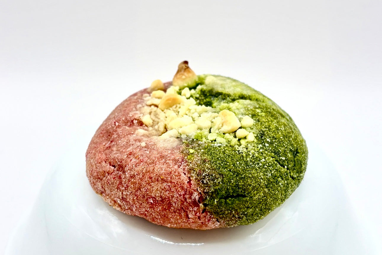 Half match half strawberry cookie on white background