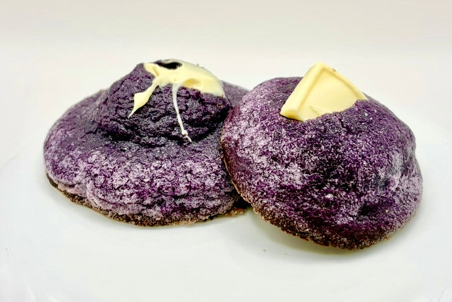 Two ube cookie stacked on white background